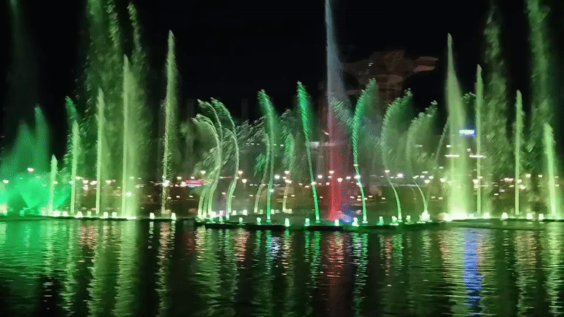 Colorful nighttime fountain show with synchronized jets and lights