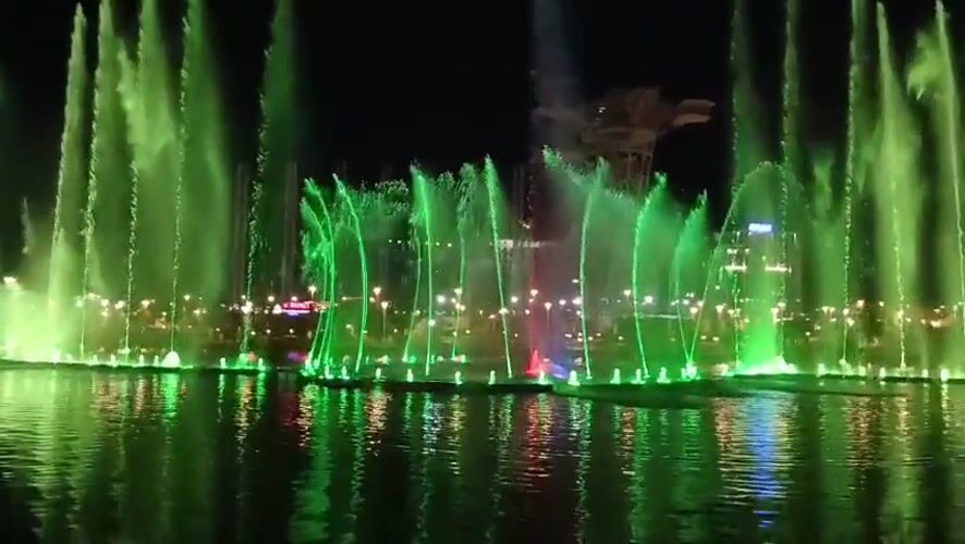 Colorful nighttime fountain show with synchronized jets and lights