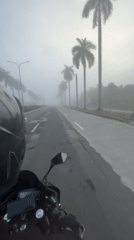 Heavy fog rolls over wet Tagum City roads at night