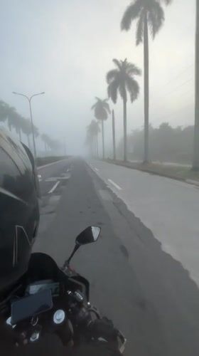 Heavy fog rolls over wet Tagum City roads at night