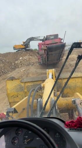 Construction worker films from wheel loader cab in Bulgaria