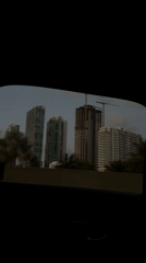 Miami skyline viewed from car window shows ongoing construction