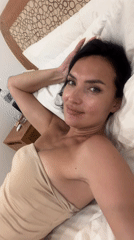 Woman records selfie videos on bed in North Kuta