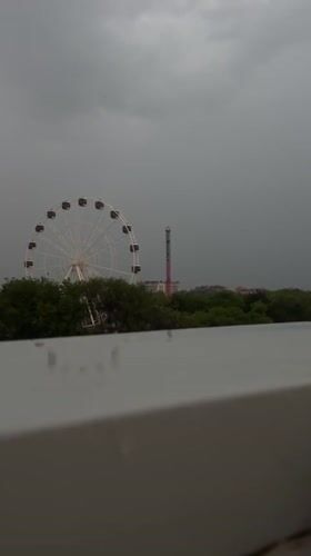 Woman documents stormy afternoon at Yevpatoriya amusement park
