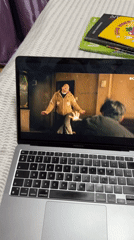 Laptop displays action scene in Tbilisi bedroom