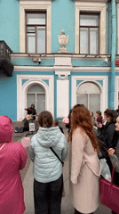 Street musician performs in Saint Petersburg drawing weekend crowds