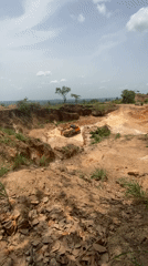 Workers load sand into truck at Nigerian excavation site