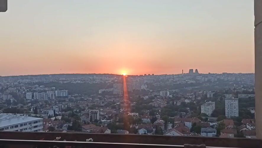 Sunrise captured over Belgrade suburb cityscape Monday morning