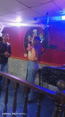 Karaoke duo performs at Caracas restaurant celebration