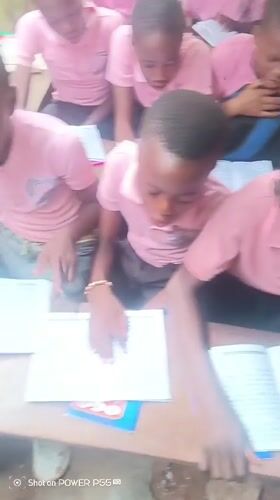 School day begins in Onitsha classroom with students and teacher