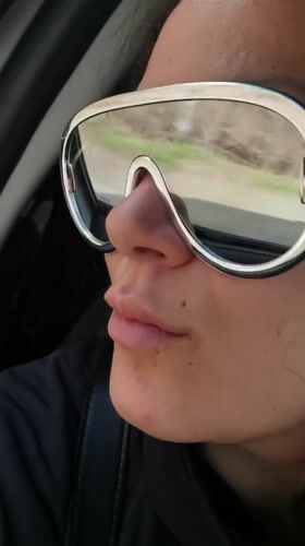 Person in silver sunglasses observed traveling through Niva, Russia