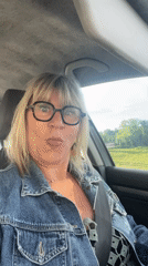 Woman makes playful faces while seated in car in Chambœuf
