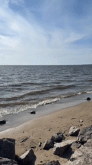 Sunny beach day documented in Kronstadt, Russia coastal scenes
