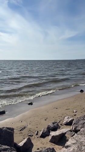 Sunny beach day documented in Kronstadt, Russia coastal scenes