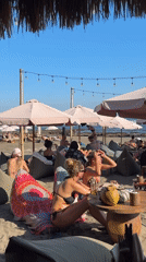 Beach club scene in North Kuta with umbrellas and beanbags
