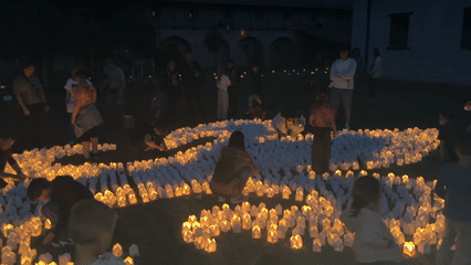 Community gathering with DJ and candles in Târgu Mureș