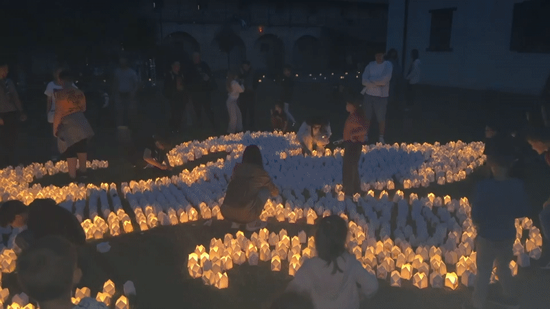 Community gathering with DJ and candles in Târgu Mureș