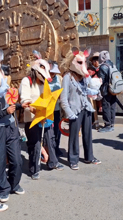 Costumed procession and creature float at Cuzco festival