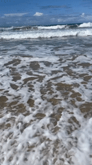 Sunny day at Surfers Paradise, waves rolling in