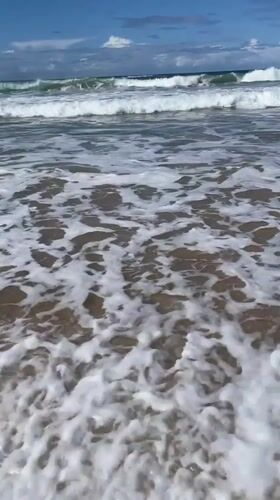Sunny day at Surfers Paradise, waves rolling in