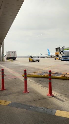 White van drives through airport parking area in Pendik
