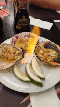 Diner captures scallops and sushi meal in Quito restaurant