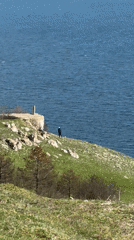 Tourists visit scenic Balchik clifftop overlook above Black Sea