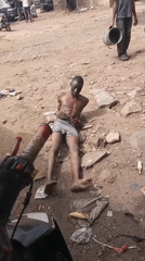 Man filmed restrained on ground in Nigeria village