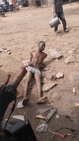Man filmed restrained on ground in Nigeria village