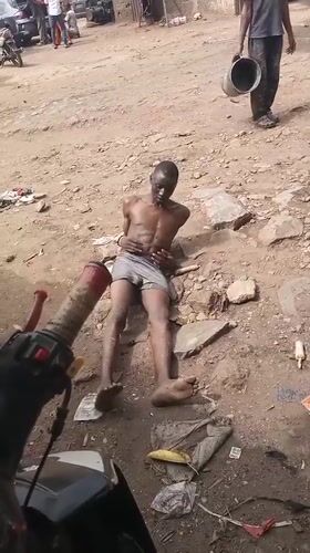 Man filmed restrained on ground in Nigeria village