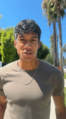 Man films video content on Beverly Hills residential street