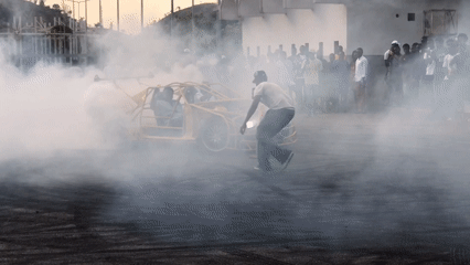 Car stunt demonstration draws spectators in Abuja parking lot
