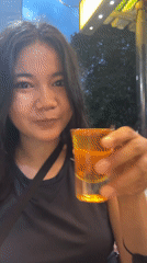 Woman samples herbal remedies at Jakarta convenience store