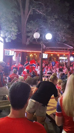 Norwegian fans pack an outdoor venue for a late-night watch party