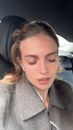 Woman records selfie video inside vehicle in Tbilisi