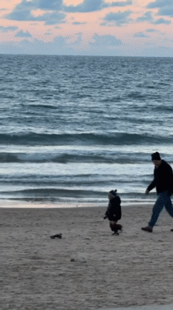 Dramatic sunset draws families to Tel Aviv beaches