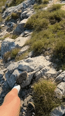Person records feet on rocky terrain in Montenegro