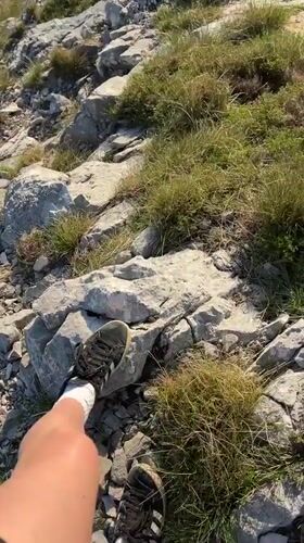 Person records feet on rocky terrain in Montenegro