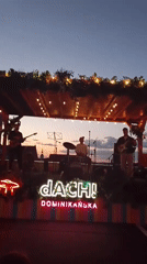 Live rooftop gig at dusk in Wrocław