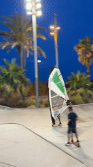 Sunset hangout on Barcelona's Barceloneta breakwater and beach
