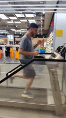 Man tests treadmill in Hanoi sports store