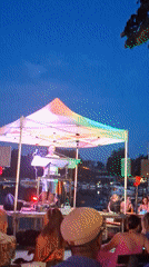 Live band plays under glowing tent at dusk in Wiesbaden