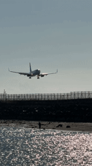 Passenger jet lands at Denpasar airport amid clear skies