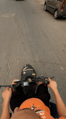 Man rides black scooter through Safi streets