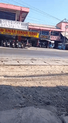 Gold shop district on a busy Sampang commercial street
