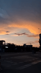 Evening urban life captured across city during sunset hours