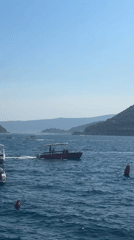 Busy afternoon along Perast's historic Adriatic waterfront