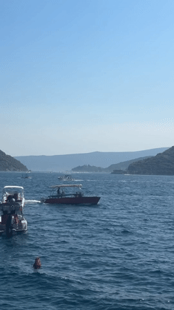 Busy afternoon along Perast's historic Adriatic waterfront