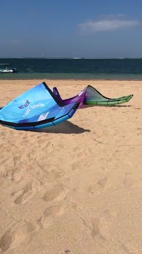 Kitesurfing kite on a Bali beach, ready to fly