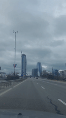 Motorsport event documented with race cars and city views
